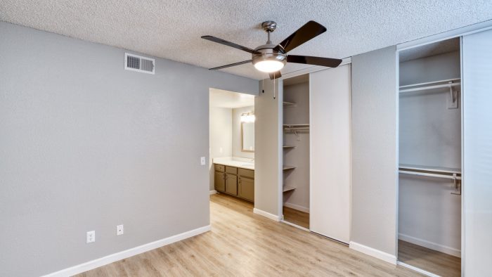 empty room with ceiling fan and closet at The Jerome